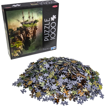 Puslespilleske med fantasy-motiv og brikker liggende foran i en haug